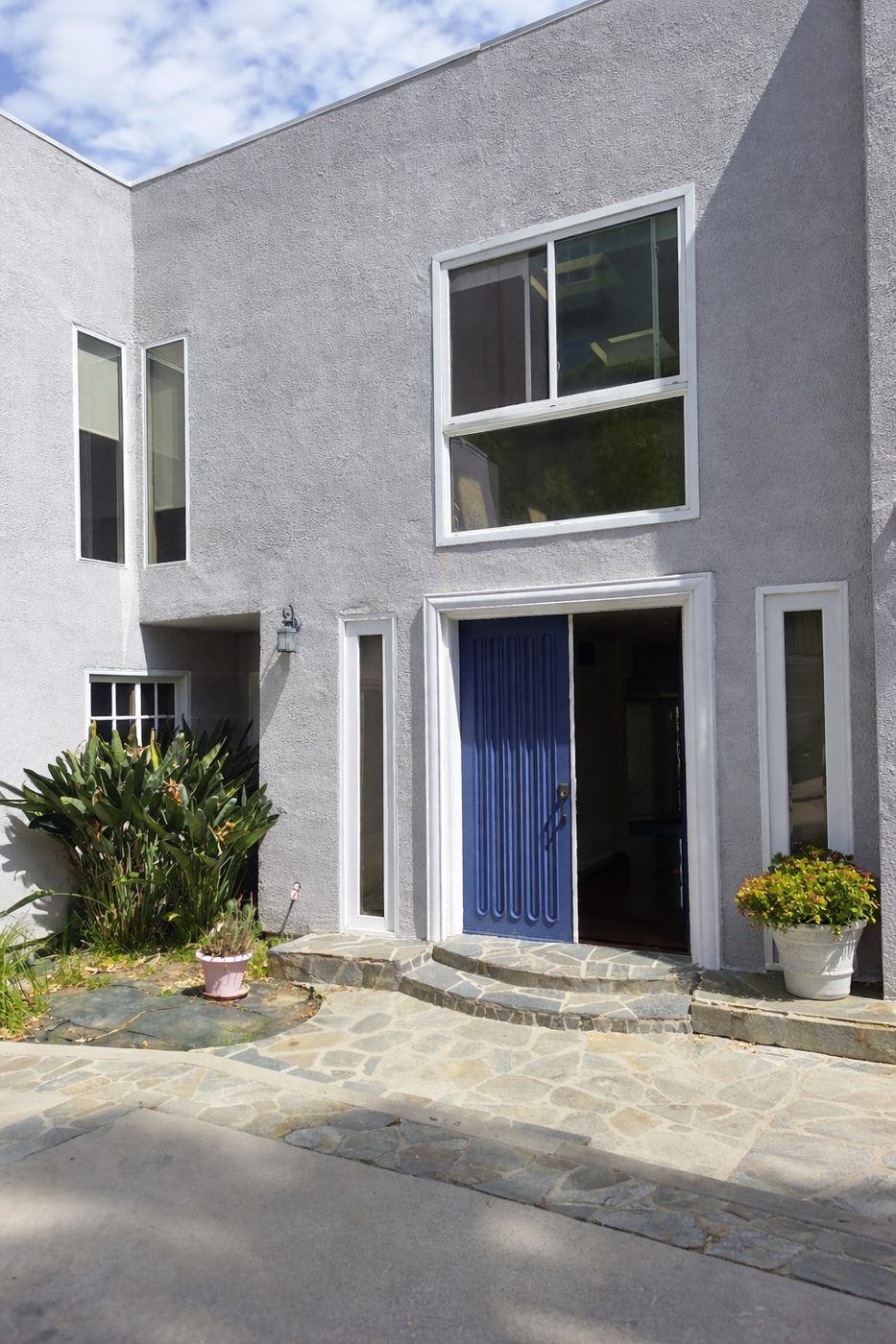 PRIVET RESIDENCE SHERMAN OAKS — two-story home remodel with blue entry door